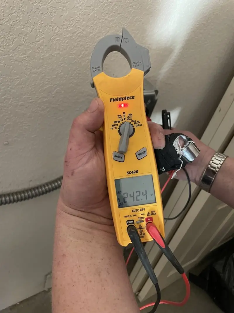 Voltage testing with clamp meter during Circuit Breaker Repair in New Castle
